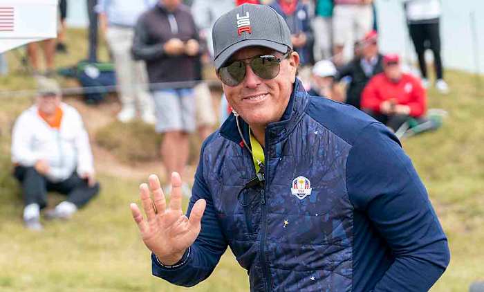 U.S. Team vice-captain Phil Mickelson waves to the fans along the 8th hole during a practice round for the 43rd Ryder Cup golf competition at Whistling Straits.